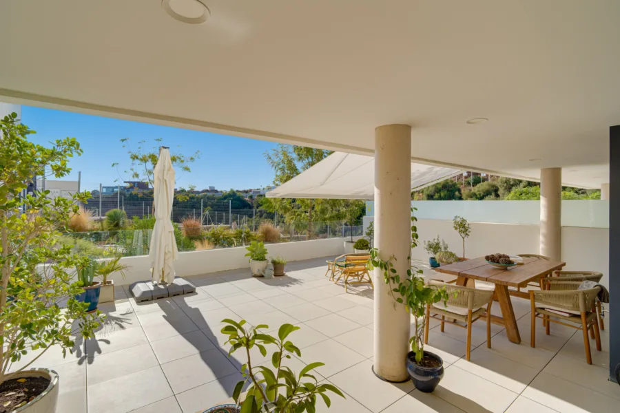 Beautifully designed, two-bedroom ground-floor apartment located in the sought-after Medblue community of Altos de Los Monteros, Marbella